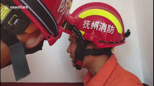 Boy somehow manages to get his head stuck in impossibly tiny gap