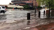 Cars drive through flooded Annapolis streets as river overflows