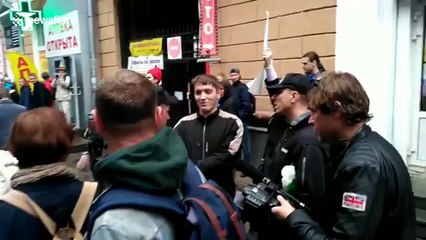 Russian couple is arrested by riot police during rally against pension reform plan