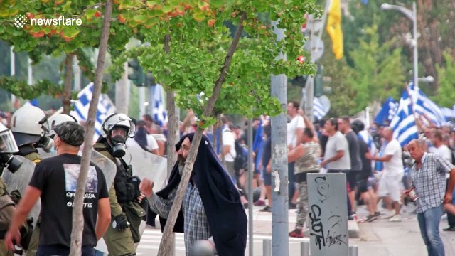 Greek riot police fire tear gas at protesters during Thessaloniki International Fair