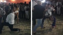 Un homme danse avec une danseuse sexy et se fait griller par sa femme