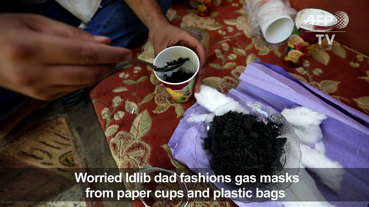 In Idlib, worried father turns paper cups into gas masks