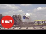 Shocking moment speeding van is filmed flying over roundabout