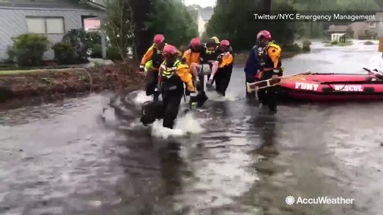 First responders from New York carry out water rescues during Florence