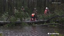 Marine Corps chainsaws uprooted tree during Florence