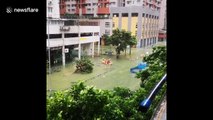 Firefighters use dinghy to rescue resident from Macau floods
