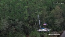 Hurricane Florence causes boat to wash into trees