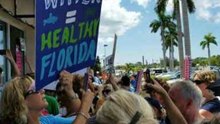 Rick Scott Uses Back Door at Campaign Event as 'Red Tide' Protesters Block Entrance