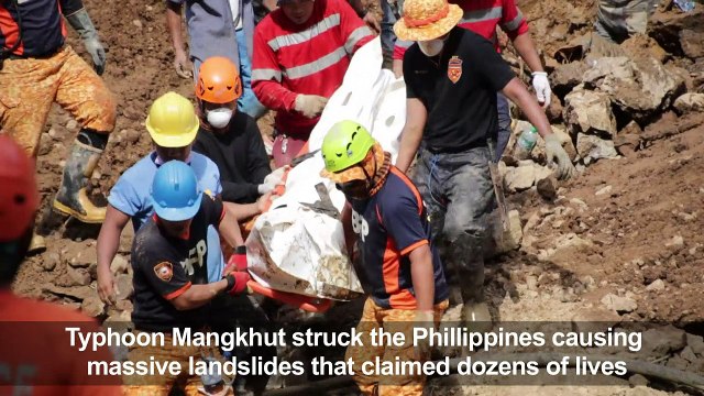 Grim search for typhoon landslide victims in the Philippines