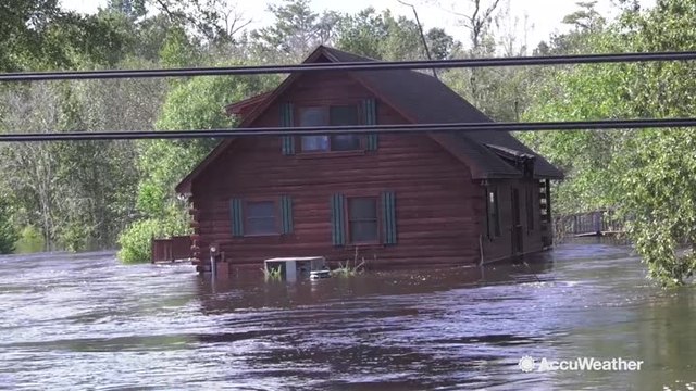 Family returns to home submerged in Florence floodwaters
