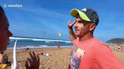 Blind professor teaches young people how to surf in northern Spain