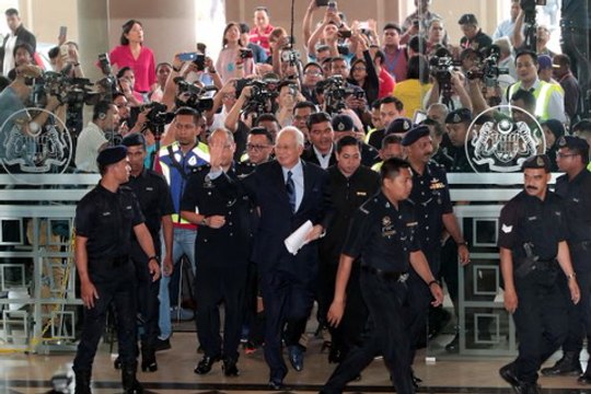 Najib claims trial to 25 graft, money laundering charges