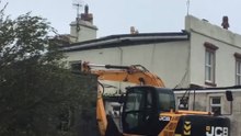 Resourceful Neighbors Use JCB to Hold Down Roof During Storm Ali
