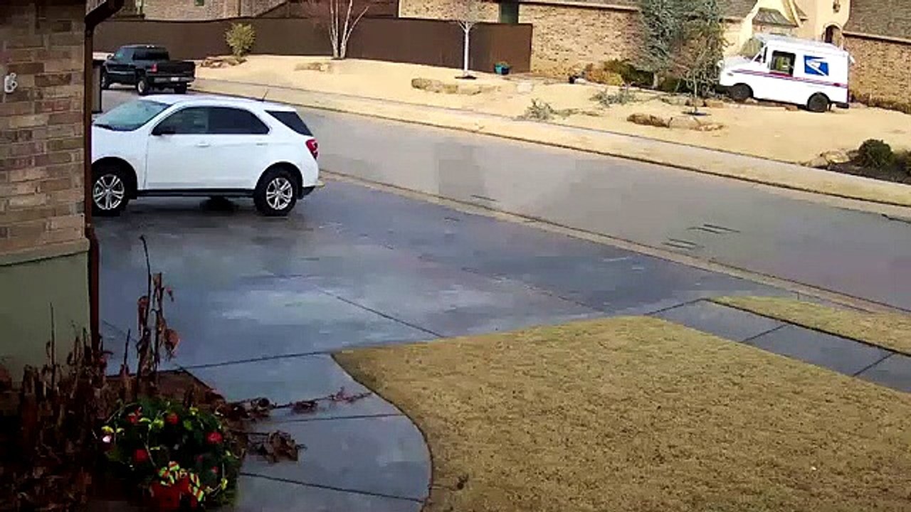 A UPS delivery person is thrown out of his van