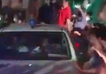 Crowd Showers Petals on Former Prime Minster's Car After Release From Jail