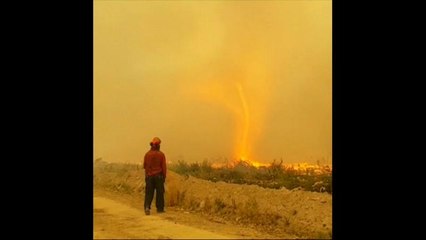 Fire tornado snatches firefighter's hose in Canada