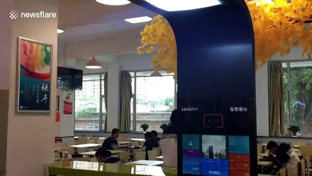 Students swipe faces to pay for meals in high school canteen