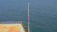 Tattered US Flag Remains on Frying Pan Tower as Camera Turns Back on After Florence