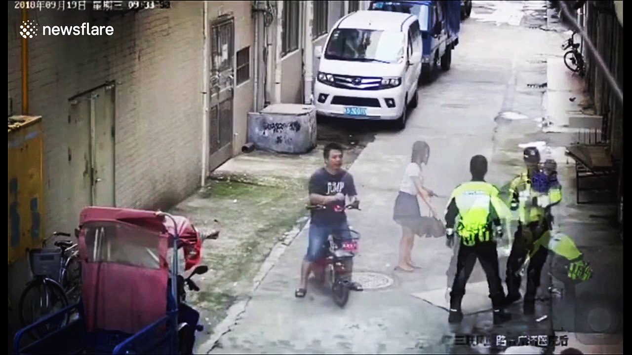 Police and delivery man catch baby falling from first-floor balcony