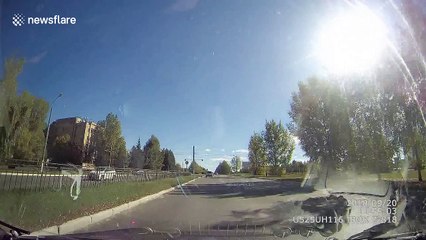 Dash-cam footage from Russia shows moment of roll-over crash after collision