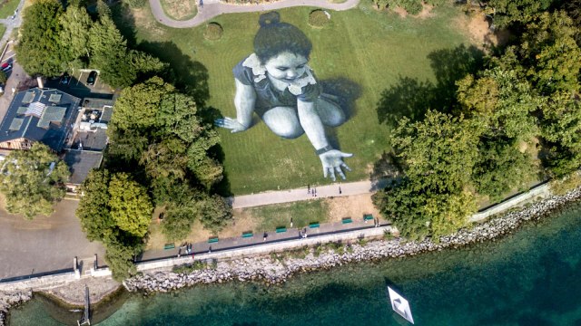 This Giant Land Painting At Lake Geneva Symbolizes Hope For Refugees