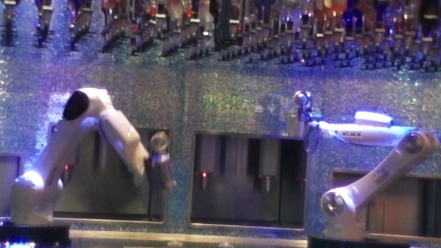 Robot bartenders in action.