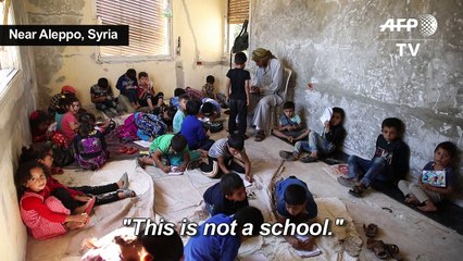 In abandoned villa, Syrian children study on the ground