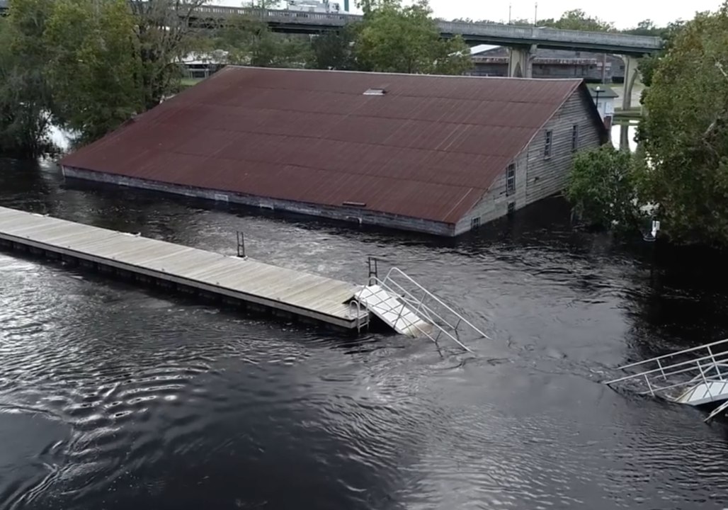Floodwater Rising in Conway, Buildings Remain Submerged