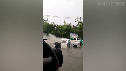 Car Stranded On Flooded Road