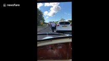 'Baby shark' meets 'In My Feelings' challenge as man hops out of car and dances in traffic jam