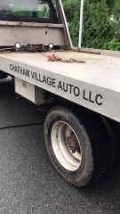 Low Riding Car with Flat Tire