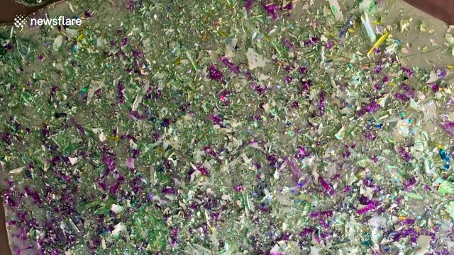 British artist turns metallic coating from old CDs into shiny, one-of-a-kind portraits