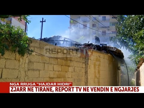 Report TV - Zjarr në Tiranë, digjet një banesë pranë tregut Çam , nxirret me shpejtësi e moshuara