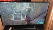 Liveleak.com - New Yorker startled to find Spiderman game scene outside his apartment window