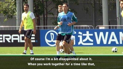 Low disappointed at Ozil for being kept in dark over retirement decision