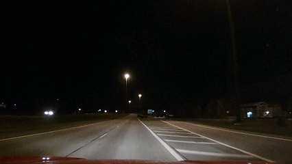 Motorcycle Narrowly Misses Moose on Dark Alaskan Roads