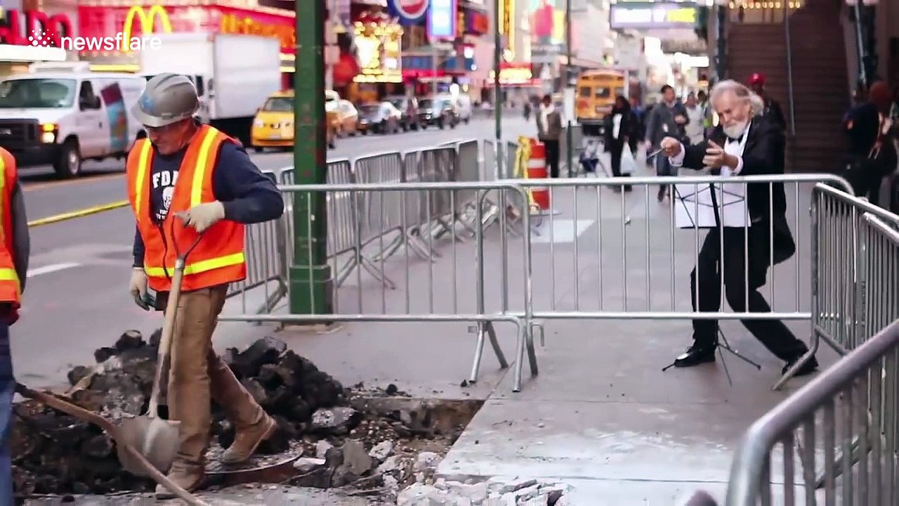 Man 'conducts' construction work symphony