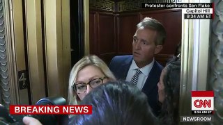Tearful woman confronts Senator Flake on elevator