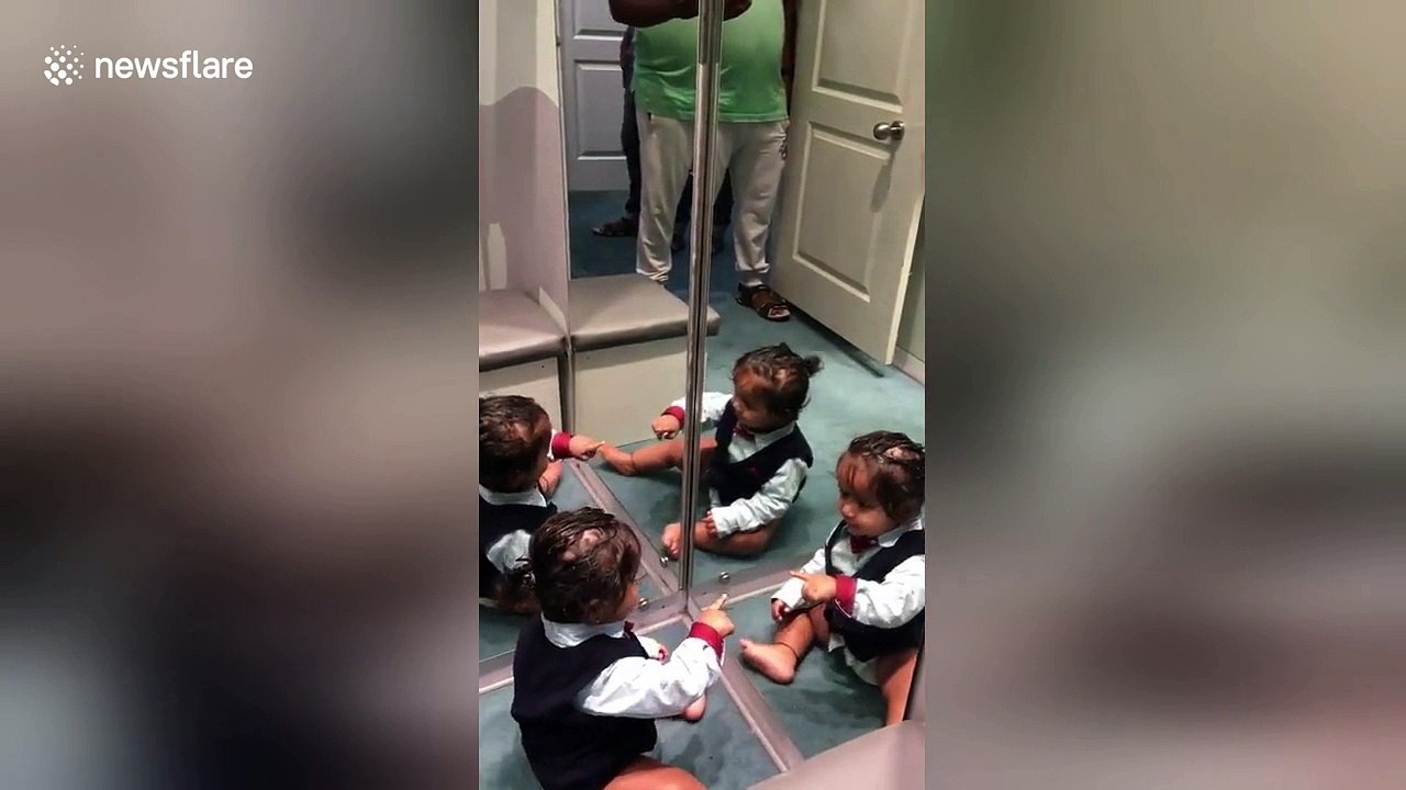 Baby boy left adorably confused by his reflection