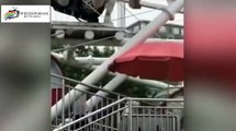 Boy dangles by his NECK 130ft in air from ferris wheel cabin after falling through window