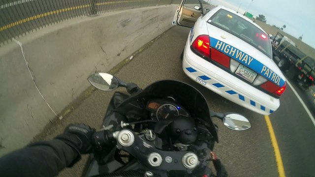 Cop Pretends to Pull Over Motorcycle Rider
