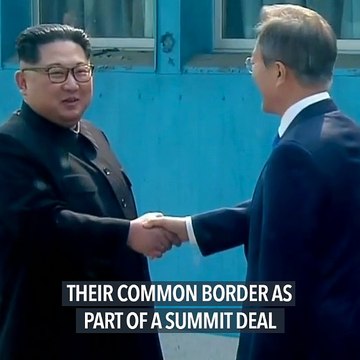 Two Koreas remove landmines at tense border