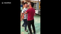 Two Chinese men fight in a very bizarre way