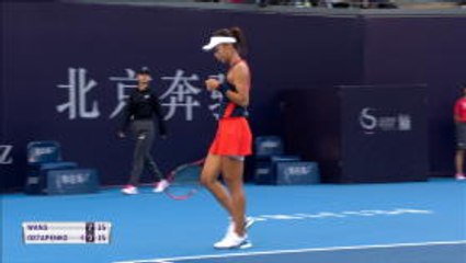 Wang double bagels Ostapenko in Beijing