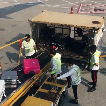 Hong Kong Airport Employees Toss Luggage Carelessly