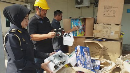 Officers destroy RM168,898 worth of pirated movies and counterfeit fashion goodies