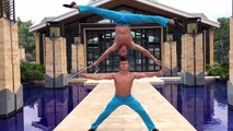 【Video】Two  men in Indonesia perform an incredible 'mirror' headstand stunt, with one balancing on the other's head completely upside-down. The man supporting t