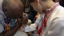Evander Holyfield 'Arm Wrestles' Orphans In Ukraine