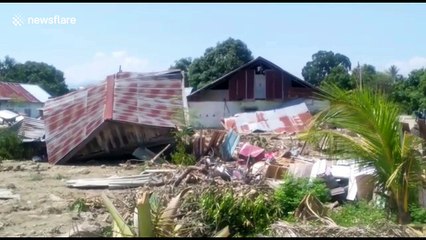 Rescuers retrieve bodies from the area as death toll passes 1,400 in Palu, Indonesia