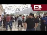 Realizan mitin trabajadores de Mexicana y el SME en el AICM  / Mariana H.